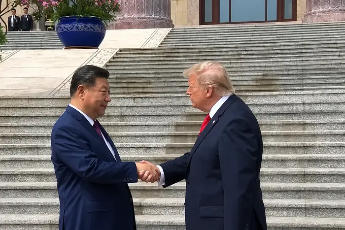 Трамп та Сі Цзіньпін влаштували «битву рукостискань»